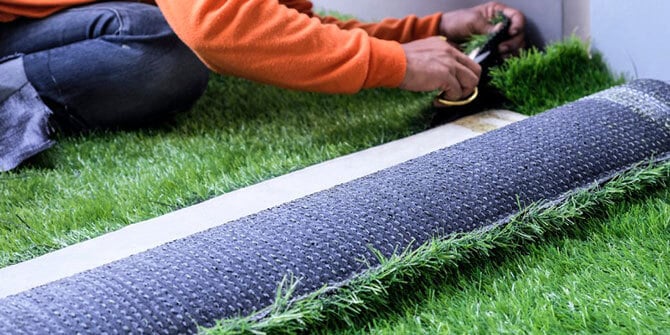 professional installing artificial turf